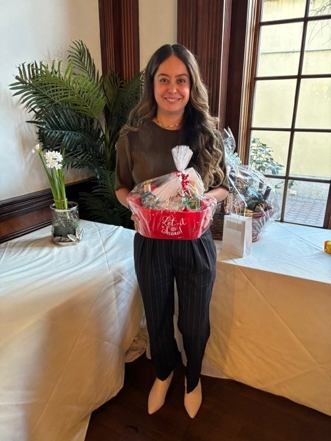 A raffle winner displaying her raffle prize