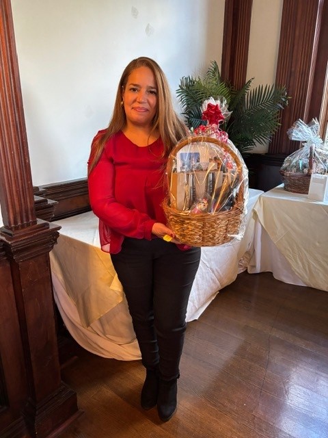 A raffle winner displaying her raffle prize