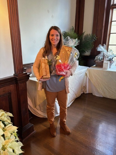 A raffle winner displaying her raffle prize