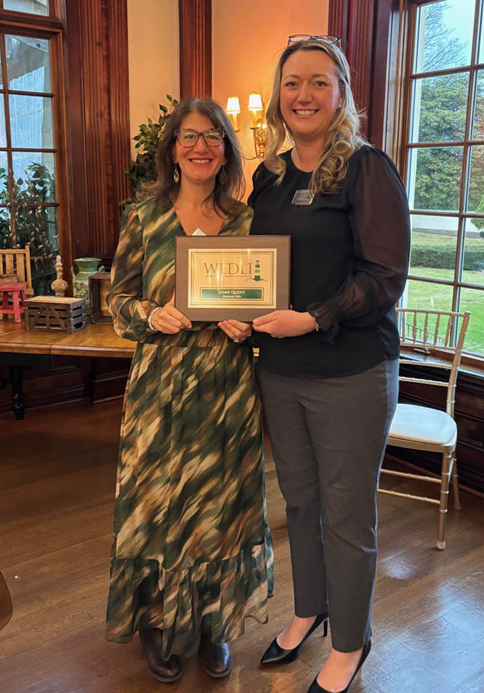 Jamie Franchi (Quent) and Catherine Fee holding a plaque