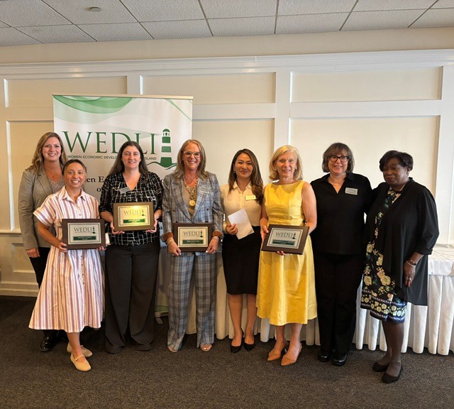 Newly inducted WEDLI members, Hon. Andrea Phoenix, and WEDLI board members